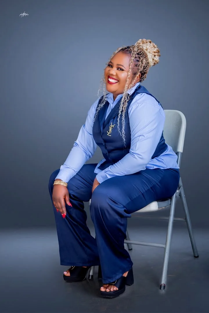 Chichi The Event Planner CEO seated, smiling in professional attire
