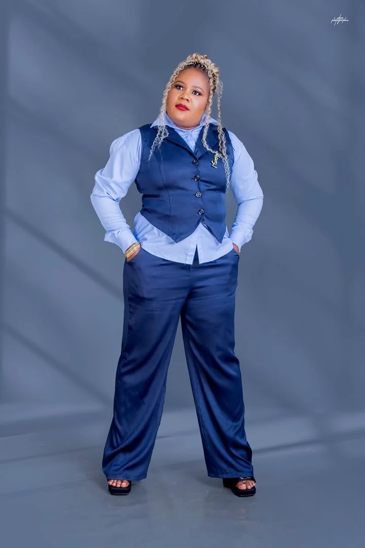 Chichi The Event Planner CEO standing confidently in navy blue professional attire